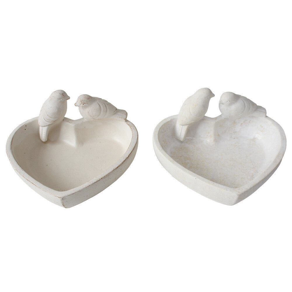 Off-white cement feeder bowl with two sculpted birds perched on the rim
