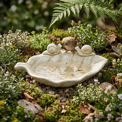 Medium snail garden water bowl styled in garden bed