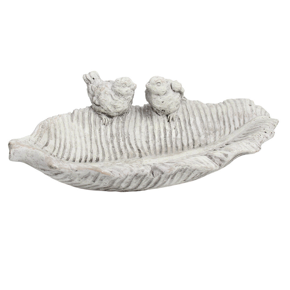 Cement leaf-shaped bird bath with two sculpted birds
