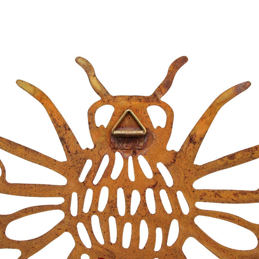 Rust bee wall art detail