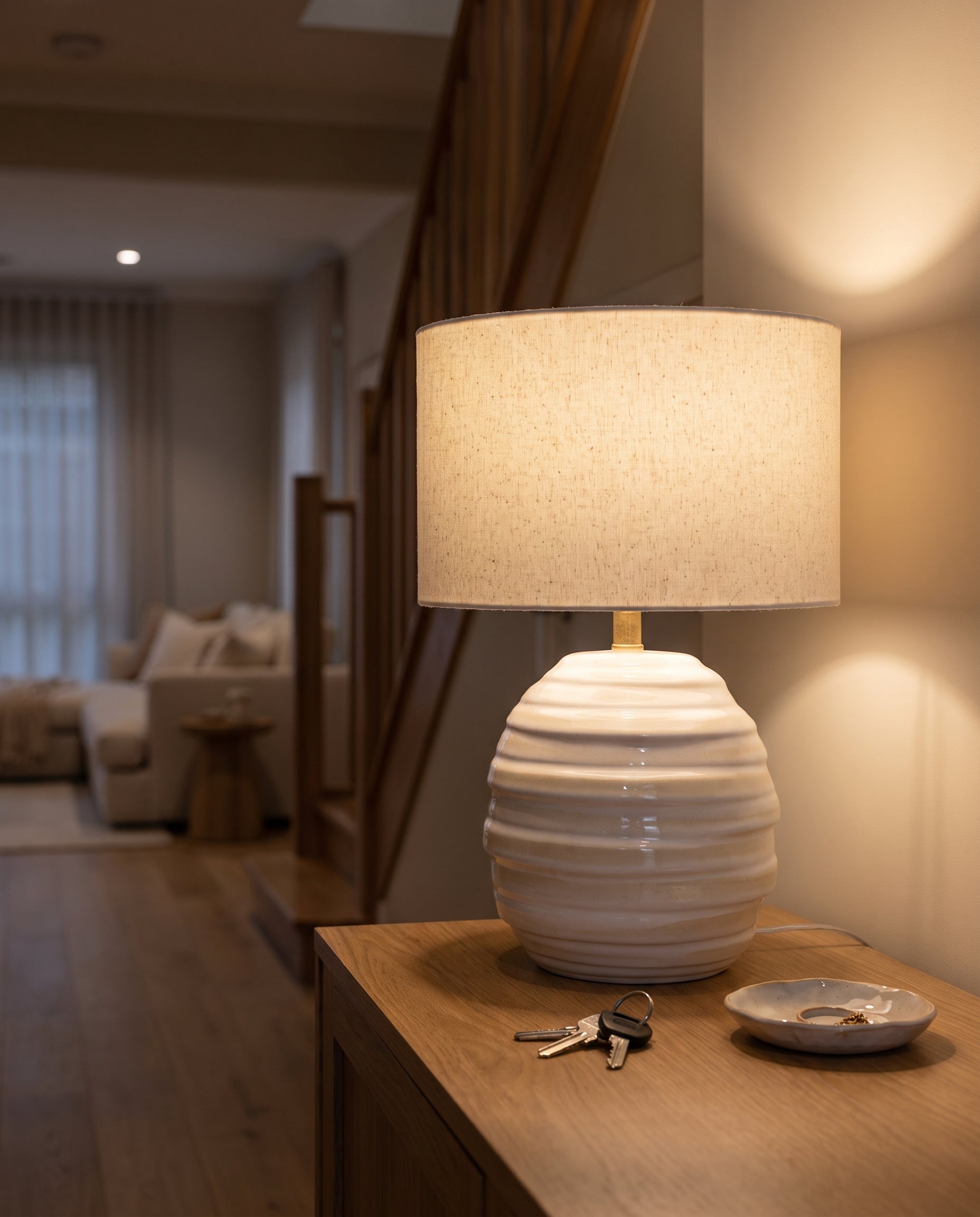 Lumara Casa Table Lamp lit at night on a hallway console — Lumara Home