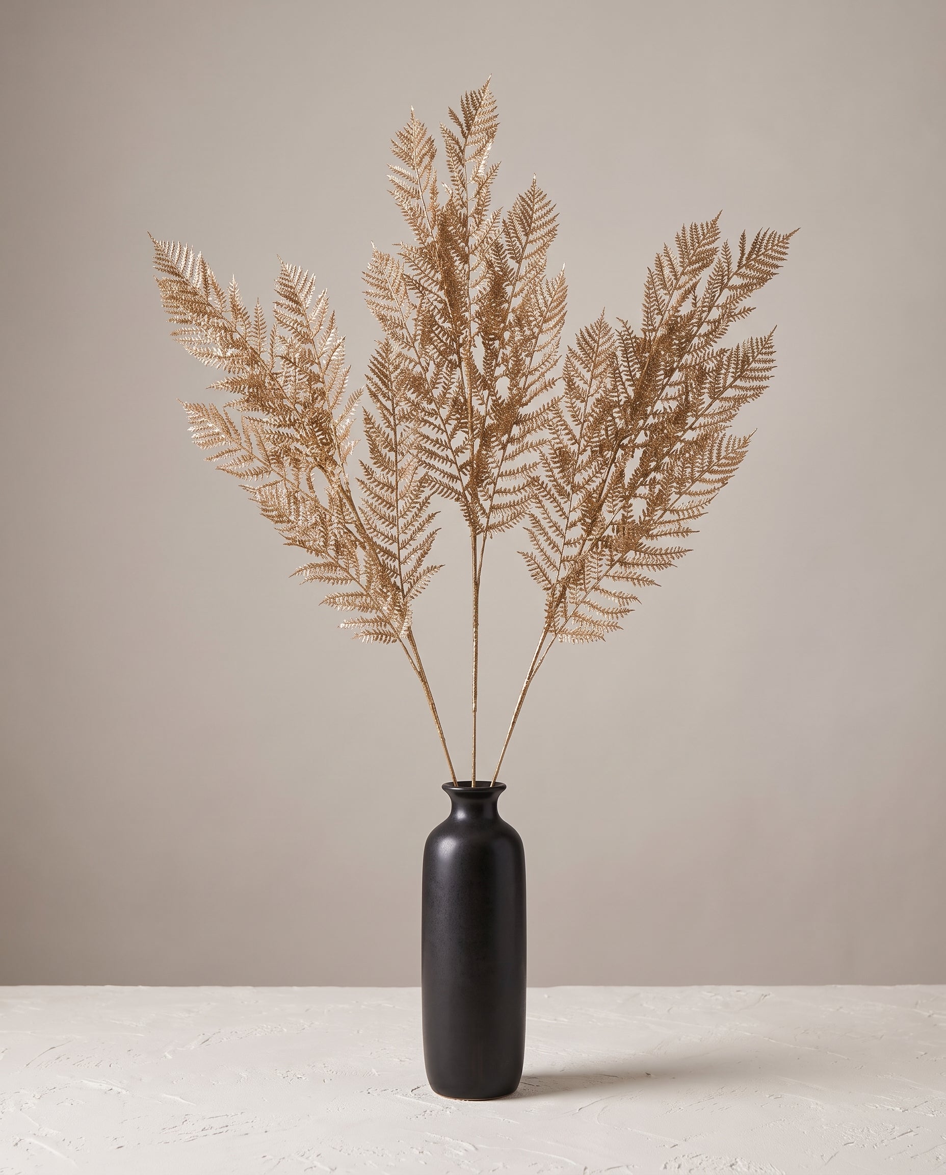 Fern Gold Stems in dark ceramic vase — Lumara Home