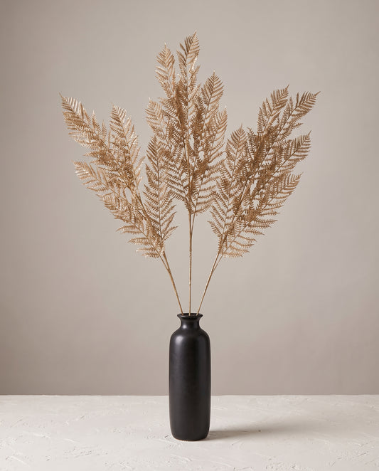Fern Gold Stems in dark ceramic vase — Lumara Home