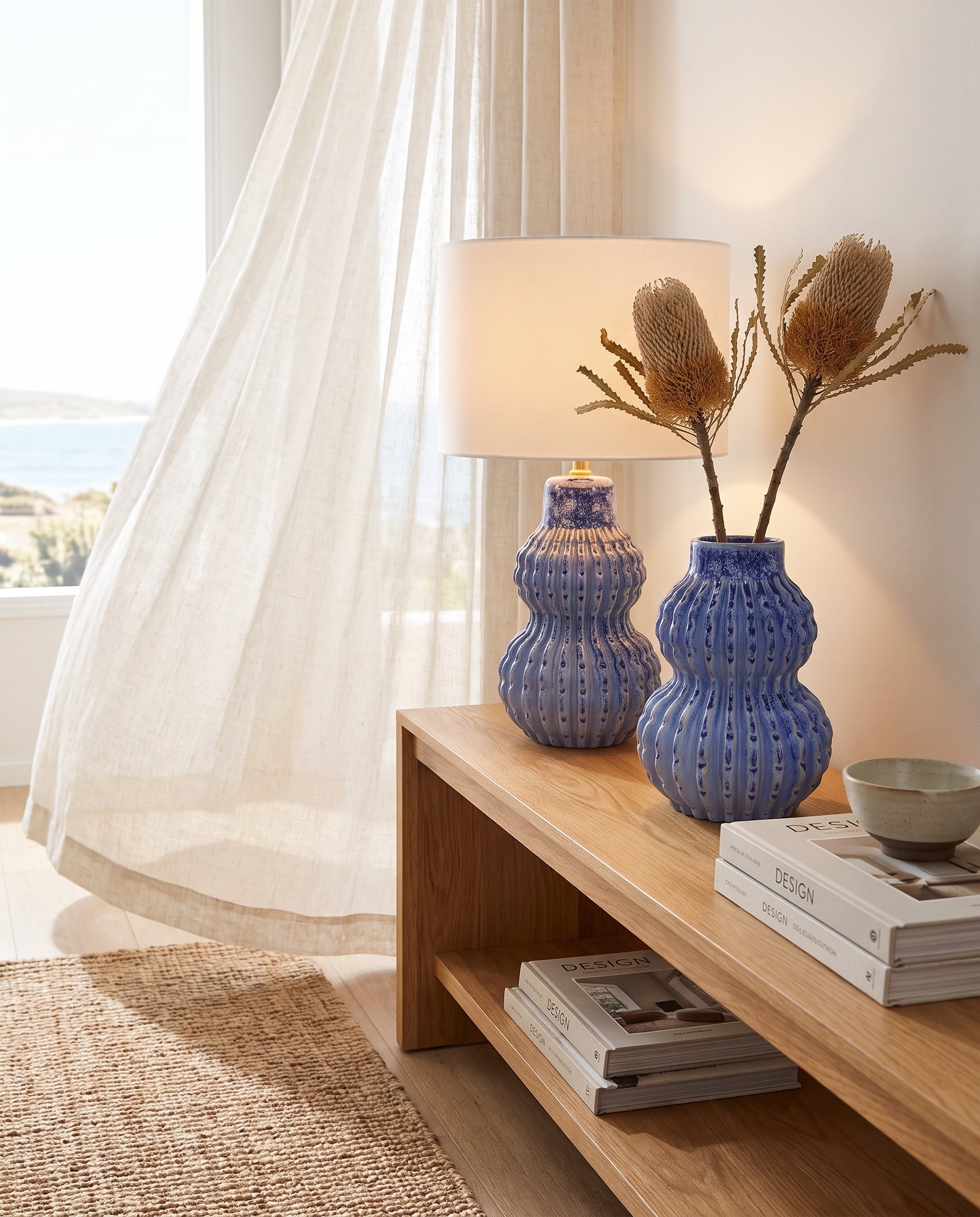 Malabar Duo lamp and vase on oak console, lamp glowing — Lumara Home