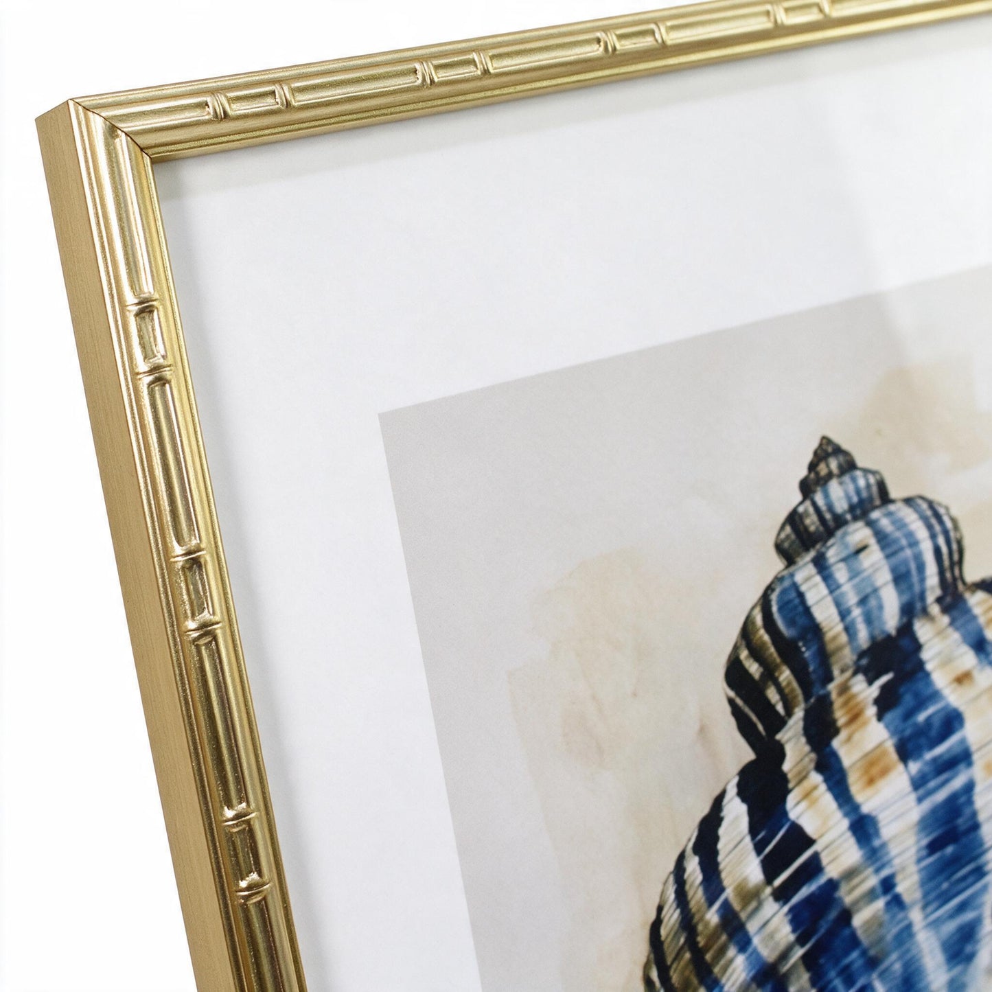 Close-up of the gold bamboo-textured frame corner on the Lumara Navy Shell Framed Print I
