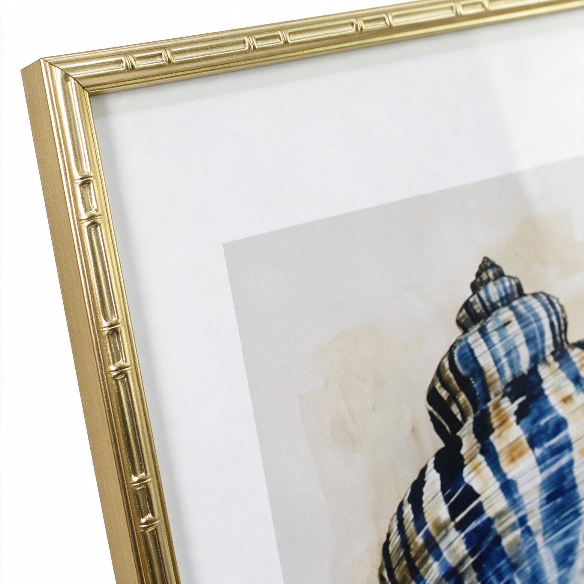 Close-up of the gold bamboo-textured frame corner on the Lumara Navy Shell Framed Print I