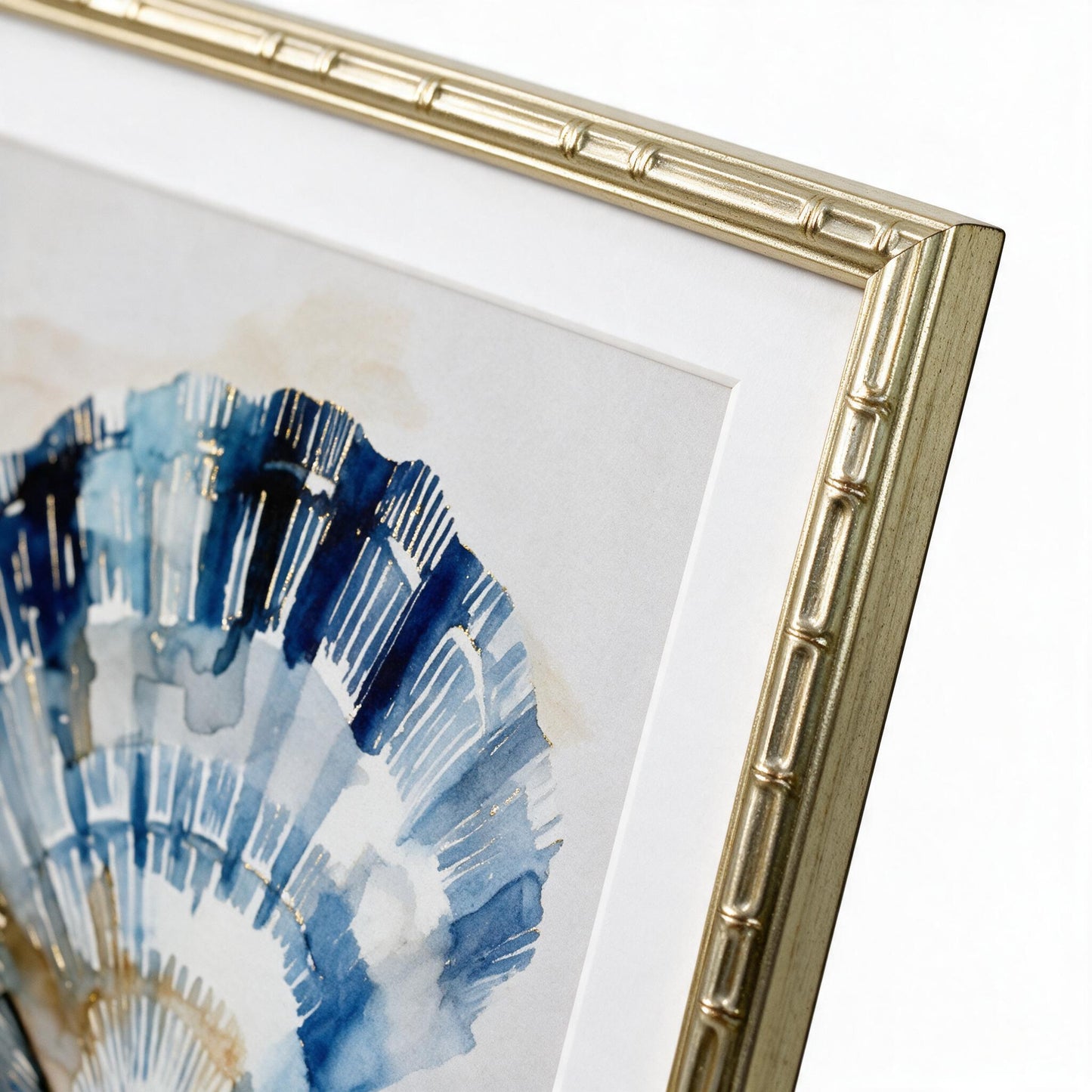 Close-up of the faded-gold bamboo-textured frame corner on the Lumara Navy Shell Framed Print II