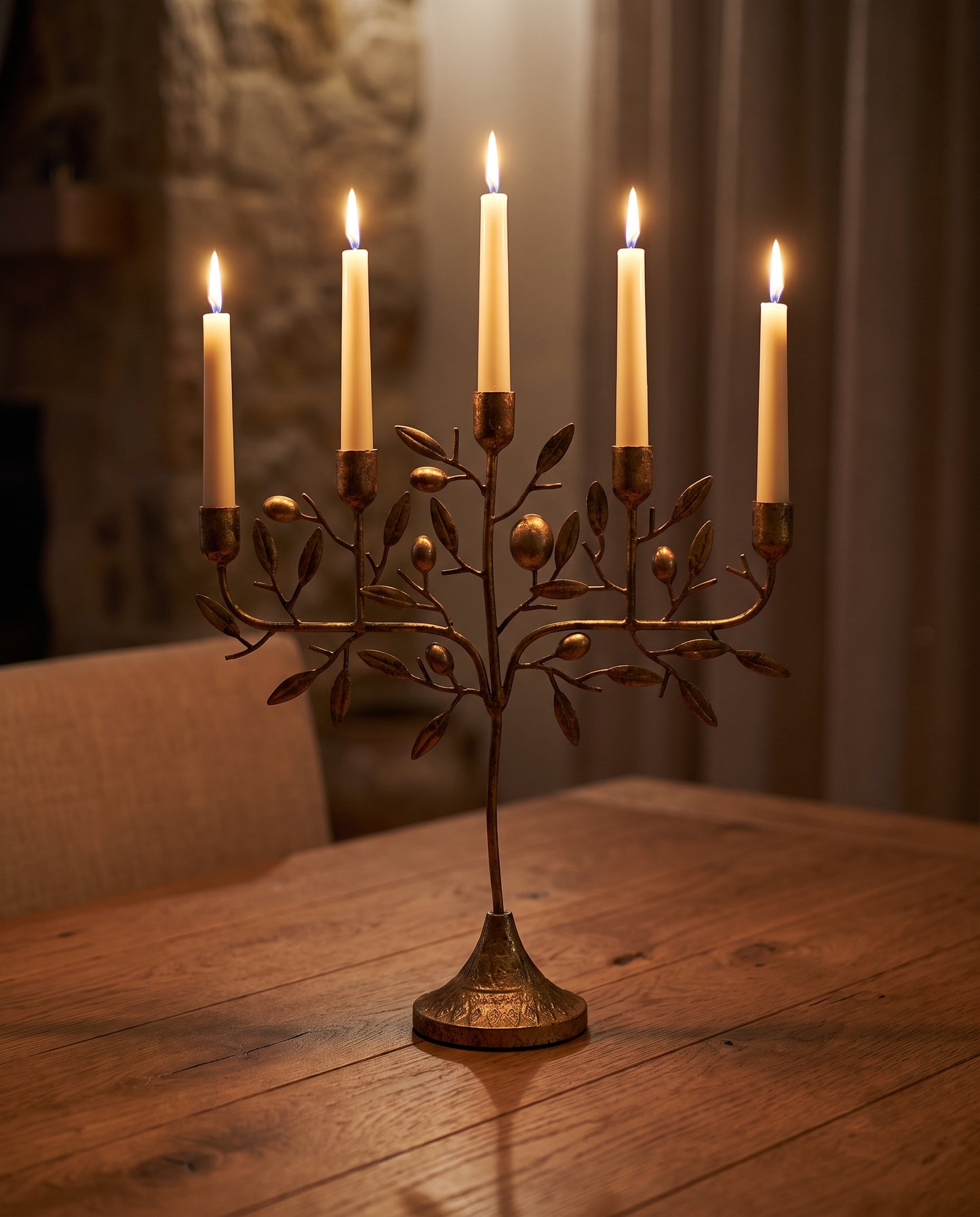 Olive Mediterranean Candelabra lit at dusk — Lumara Home