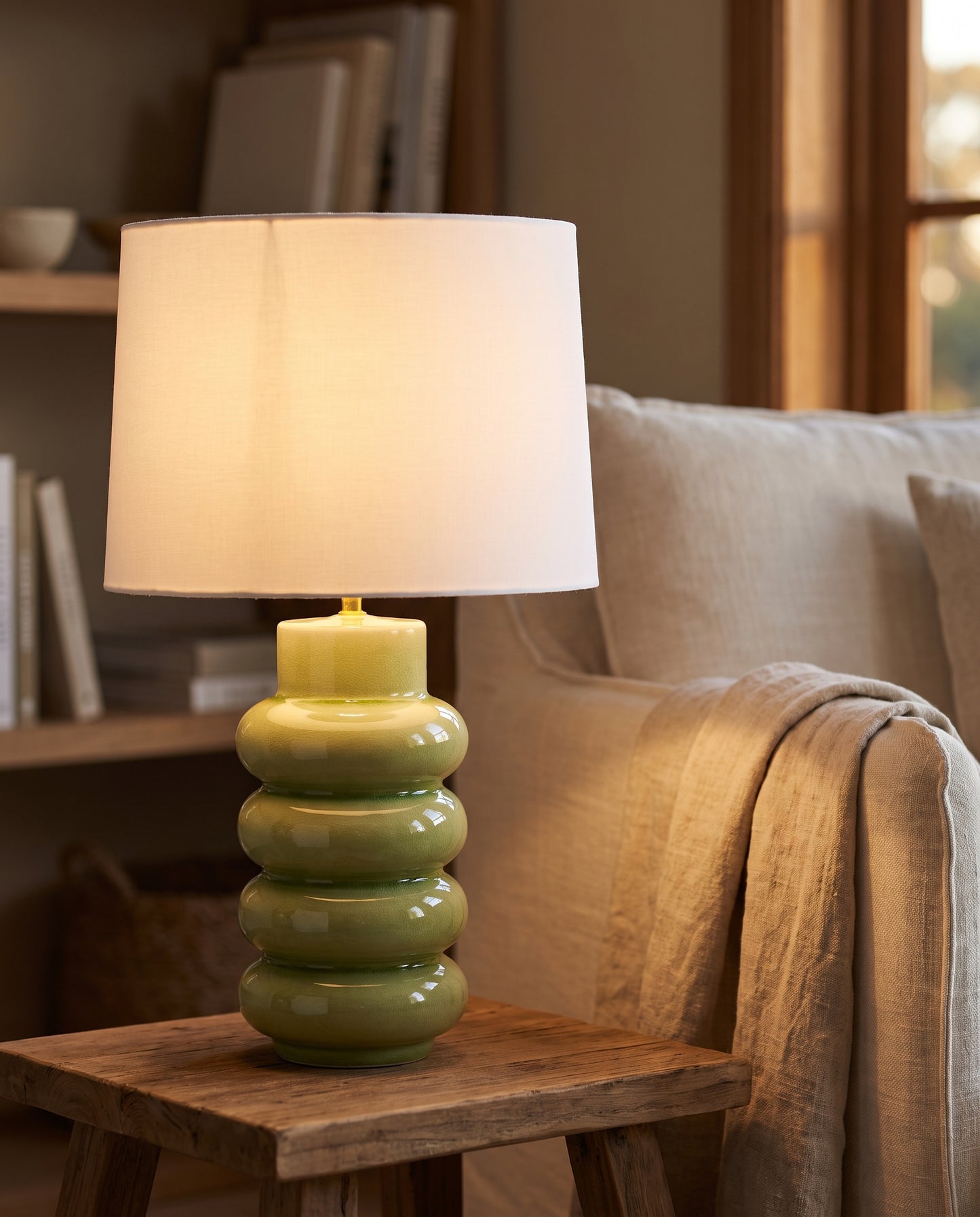 Lumara Pear Table Lamp lit at dusk in a reading corner — Lumara Home