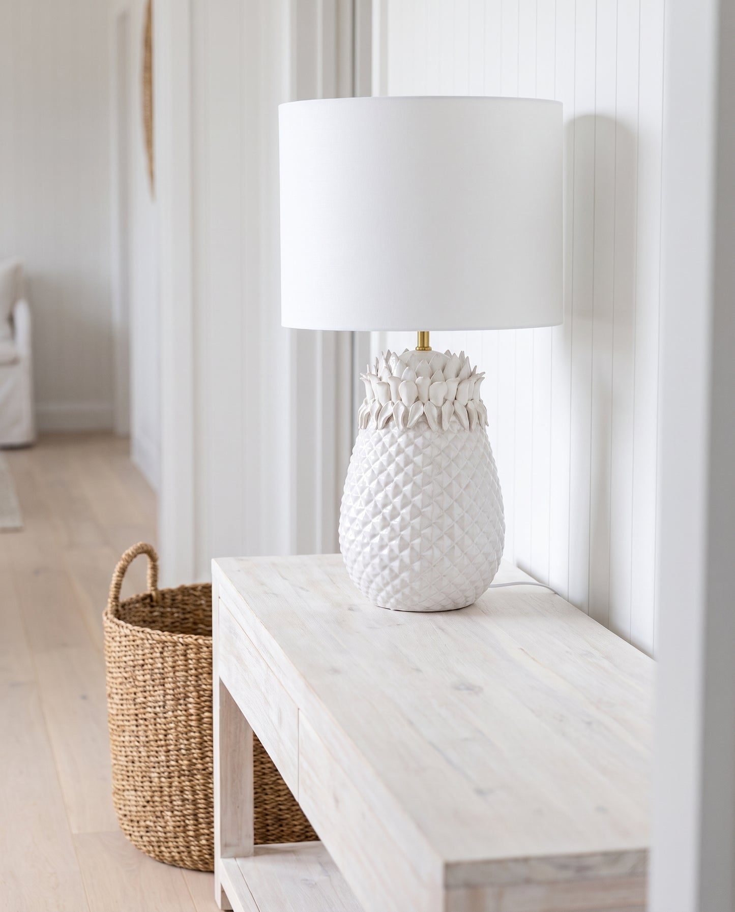 White Pineapple Table Lamp in a coastal hallway — Lumara Home