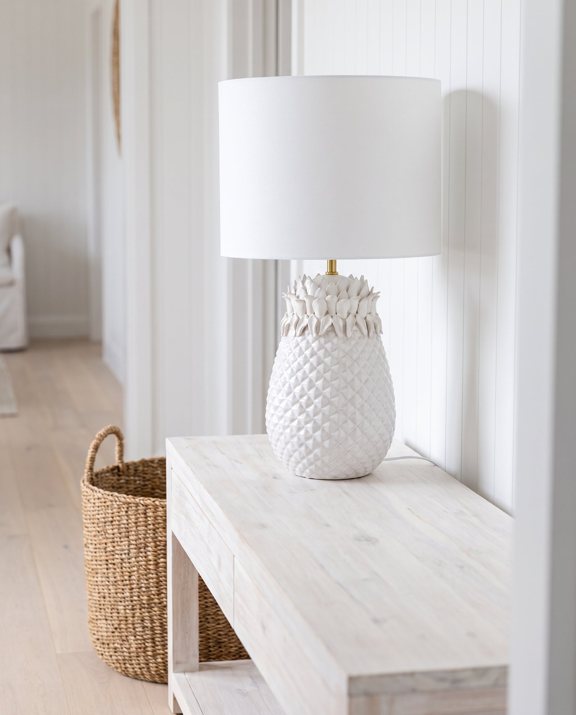 White Pineapple Table Lamp in a coastal hallway — Lumara Home