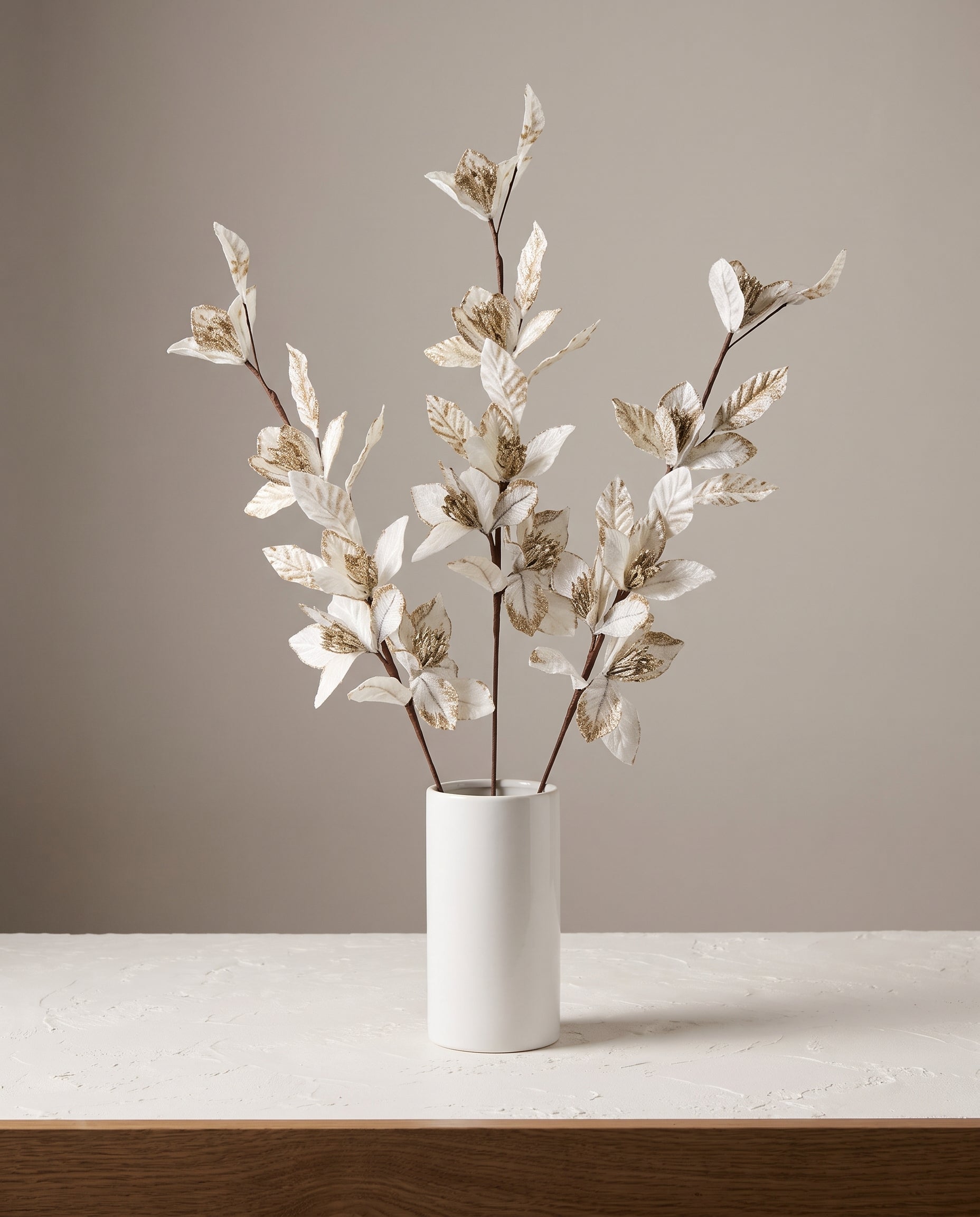 Velvet Leaf Stems in ivory styled in white ceramic vase — Lumara Home