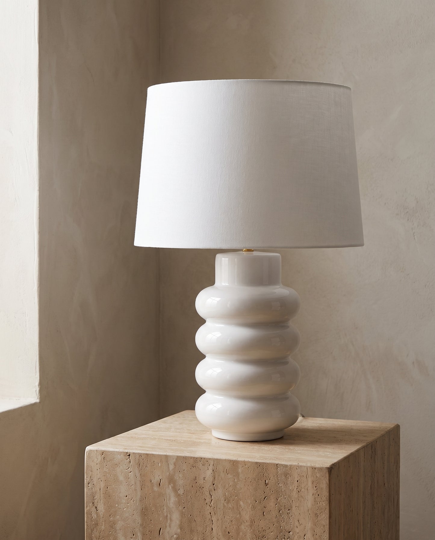 Lumara White Foam Table Lamp — studio hero on travertine — Lumara Home